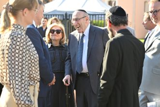 Mr. Emil Fish speaks with guests of the Ceremony