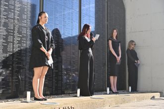 Lighting of the Memorial Candles by students from Leonard Stöckel High School