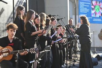The Blue Art School Children's Choir and student musicians performed the Hebrew song Ani Ve'Ata ("You and I Will Change the World")