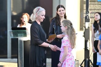 Winners of the Essay and Art Contest were called to the stage to accept their award and receive certificates